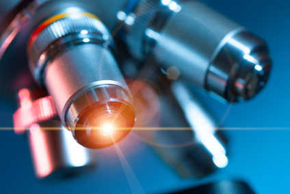 microscope lens with a beam of green light